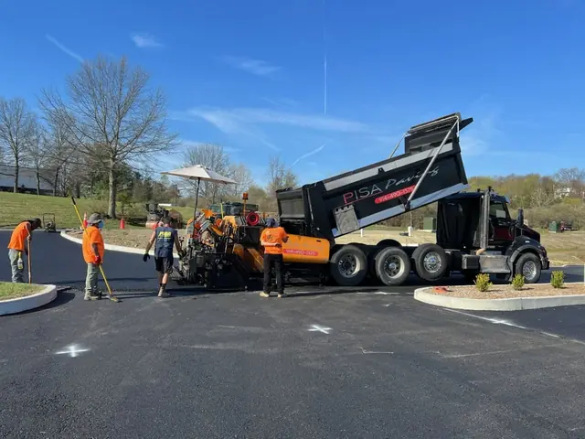 Crew paving a driveway