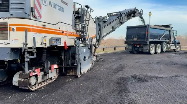Milling machine removing old asphalt